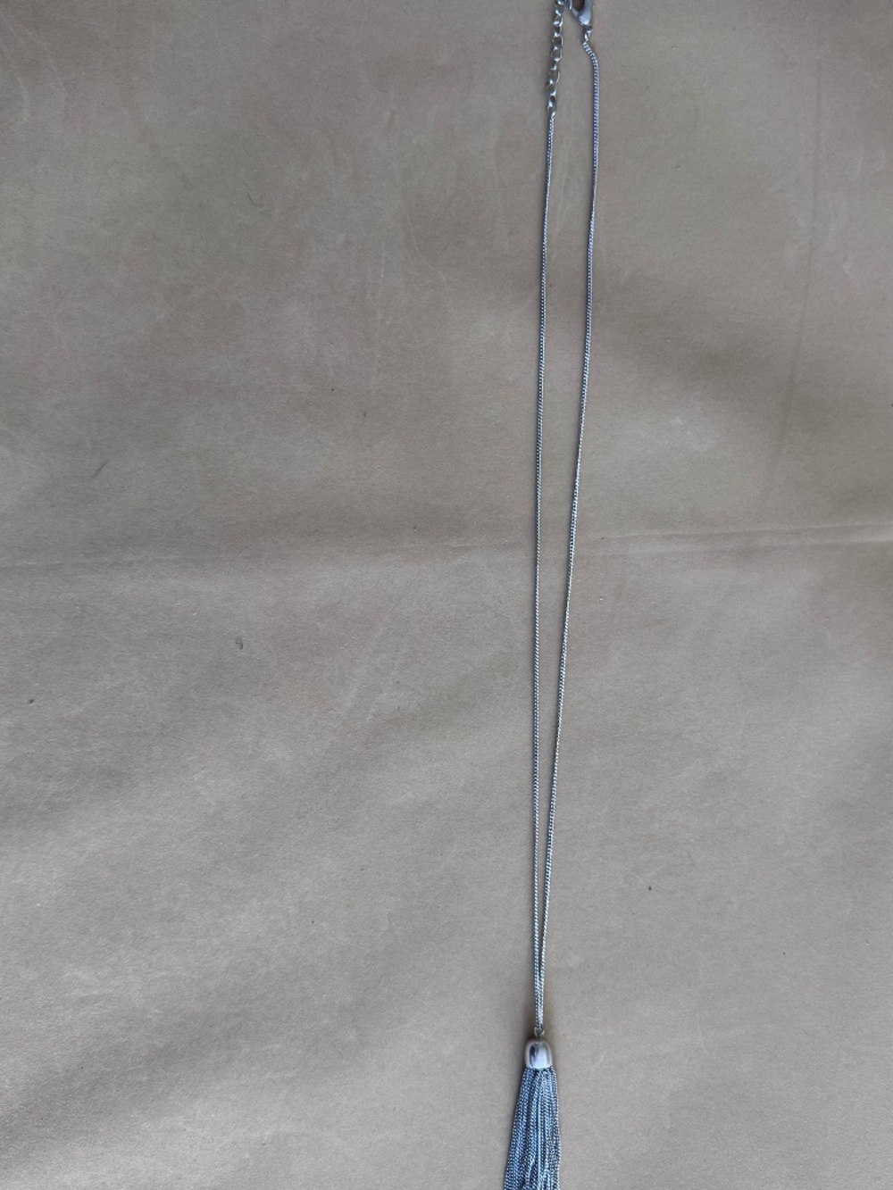 Silver-tone chain necklace with a tassel pendant